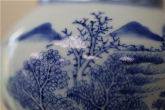 A Chinese blue and white beaker landscape vase, gu, Kangxi period, H. 30.5cm, lean to one side